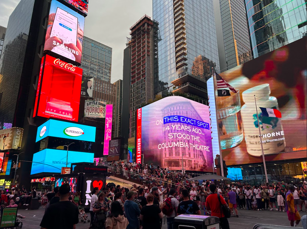 Times Square crows surrounded by video screens